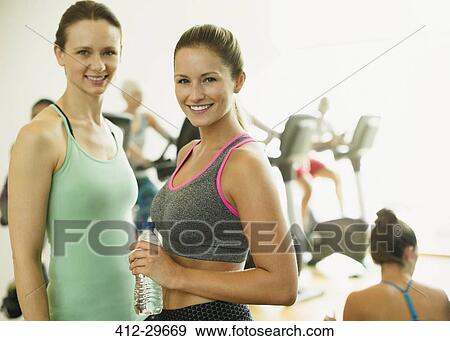Portrait smiling women resting at gym View Large Photo Image Stock Photo - Portrait smiling women resting at gym. Fotosearch