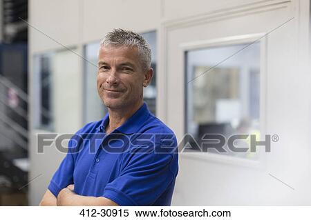 Portrait smiling worker in steel factory View Large Photo Image Stock Photography - Portrait smiling worker in steel factory. Fotosearch