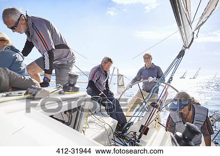 Picture - Retired friends sailing. Fotosearch