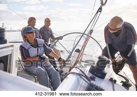 Stock Image - Retired friends sailing. Fotosearch