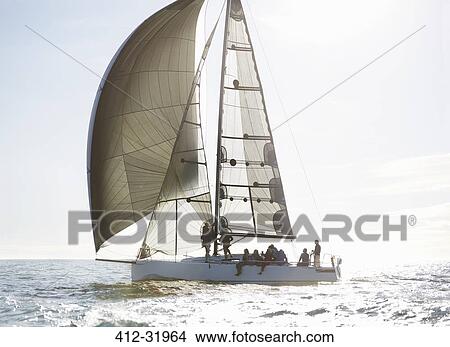 Picture - Sailboat on sunny ocean. Fotosearch