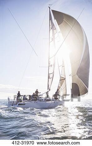 Sailboat on sunny ocean View Large Photo Image Stock Image - Sailboat on sunny ocean. Fotosearch