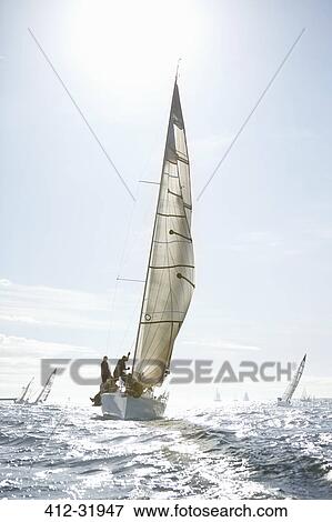 Sailboats on sunny ocean View Large Photo Image Stock Photo - Sailboats on sunny ocean. Fotosearch