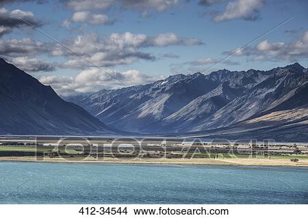 Scenic view of mountains and Lake Ohau, South Island New Zealand View Large Photo Image Picture - Scenic view of mountains and Lake Ohau, South Island New Zealand. Fotosearch