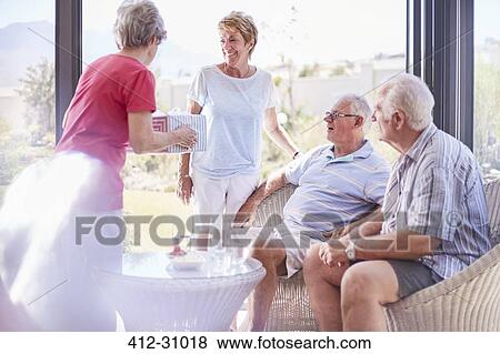 Senior adults celebrating birthday View Large Photo Image Stock Photo - Senior adults celebrating birthday. Fotosearch