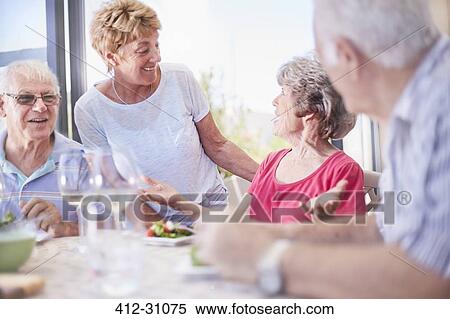 Stock Photography - Senior couples enjoying lunch. Fotosearch