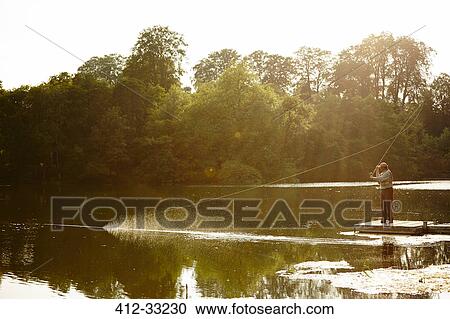 Senior man fly fishing on summer lake View Large Photo Image Stock Image - Senior man fly fishing on summer lake. Fotosearch