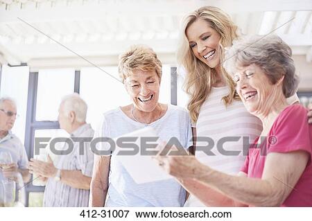 Senior women using digital tablet View Large Photo Image Stock Photo - Senior women using digital tablet. Fotosearch