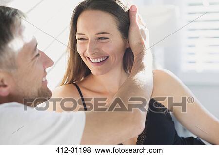 Stock Photo - Smiling affectionate couple. Fotosearch