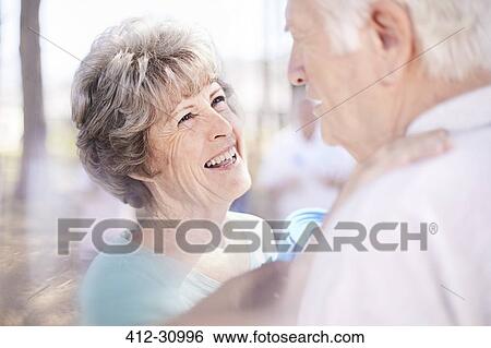 Stock Photograph - Smiling affectionate senior couple. Fotosearch