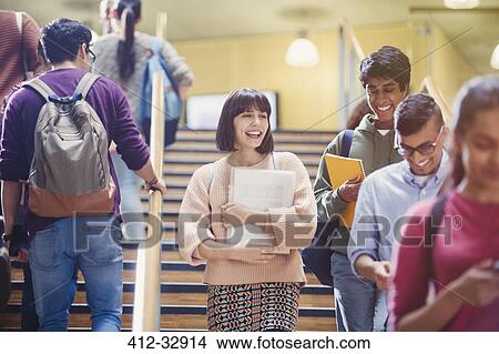 Picture - Smiling college students on stairway. Fotosearch