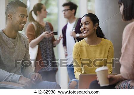 Smiling college students studying drinking coffee View Large Photo Image Stock Photo - Smiling college students studying drinking coffee. Fotosearch
