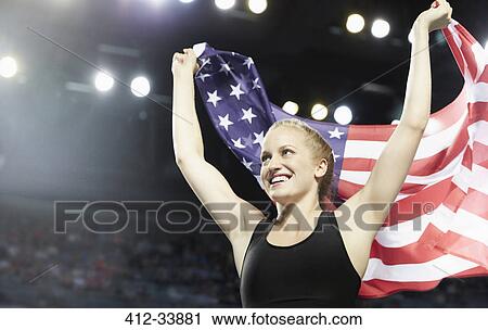 Smiling female runner running victory lap with American flag View Large Photo Image Stock Image - Smiling female runner running victory lap with American flag. Fotosearch