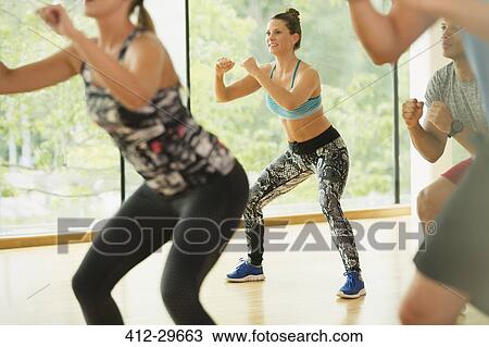 Smiling woman enjoying aerobics class View Large Photo Image Stock Image - Smiling woman enjoying aerobics class. Fotosearch