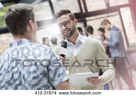 Picture - Speaker with microphone at technology conference. Fotosearch