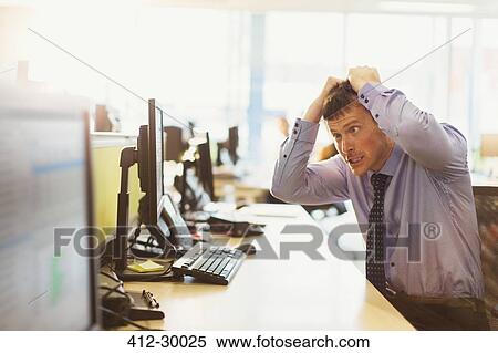 Stressed businessman pulling his hair out at computer in office View Large Photo Image Stock Photography - Stressed businessman pulling his hair out at computer in office. Fotosearch