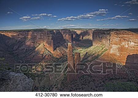 Stock Image - Sun and shadows over Spider Rock, Canyon de Chelly, Arizona, United States. Fotosearch