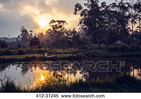 Sun setting over tranquil jungle, Madagascar View Large Photo Image Stock Photography - Sun setting over tranquil jungle, Madagascar. Fotosearch
