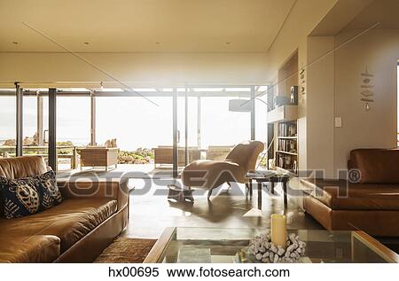 Sunny home showcase living room with open patio doors View Large Photo Image Stock Photography - Sunny home showcase living room with open patio doors. Fotosearch