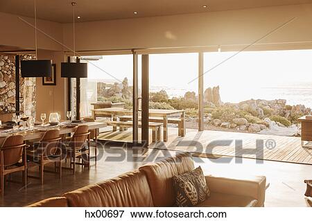 Stock Photo - Sunny home showcase open to patio. Fotosearch