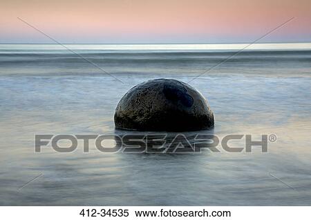 Tranquil seascape and boulder, Moeraki Boulders, South Island, New Zealand View Large Photo Image Stock Photography - Tranquil seascape and boulder, Moeraki Boulders, South Island, New Zealand. Fotosearch