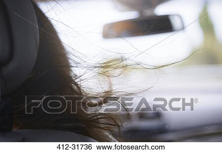 Womans hair blowing in car View Large Photo Image Stock Photograph - Womans hair blowing in car. Fotosearch