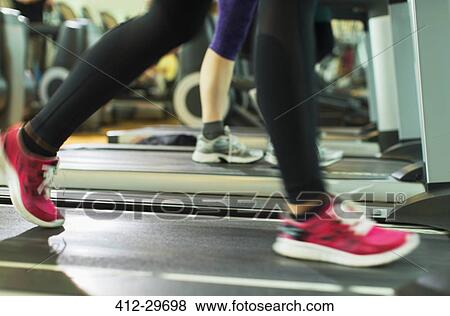 Womans legs running on treadmill at gym View Large Photo Image Stock Photo - Womans legs running on treadmill at gym. Fotosearch