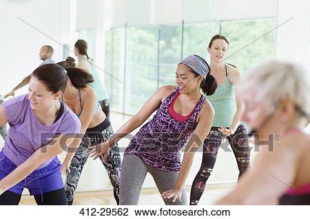 Stock Image - Women enjoying aerobics class. Fotosearch