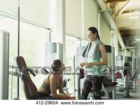 Women talking and resting at gym View Large Photo Image Picture - Women talking and resting at gym. Fotosearch