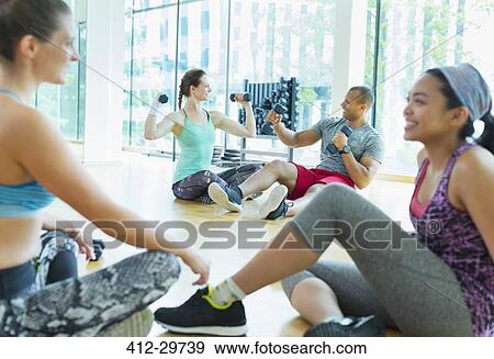 Women talking and resting at gym View Large Photo Image Stock Photo - Women talking and resting at gym. Fotosearch