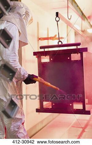 Worker painting steel red in steel factory View Large Photo Image Stock Image - Worker painting steel red in steel factory. Fotosearch