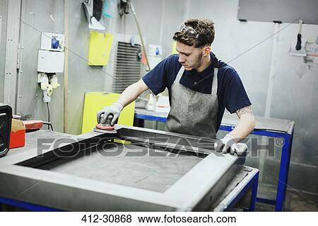 Worker sanding steel in steel factory View Large Photo Image Stock Photo - Worker sanding steel in steel factory. Fotosearch