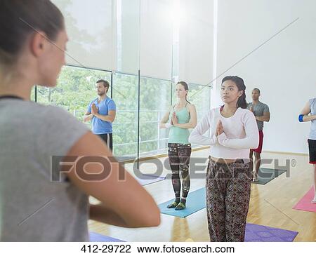 Yoga class with hands at prayer position View Large Photo Image Stock Image - Yoga class with hands at prayer position. Fotosearch