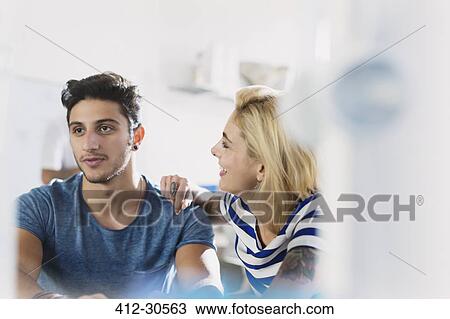 Young couple talking View Large Photo Image Stock Image - Young couple talking. Fotosearch