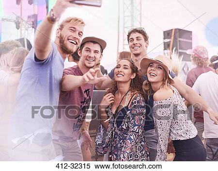 Young friends posing for selfie at music festival View Large Photo Image Stock Photography - Young friends posing for selfie at music festival. Fotosearch