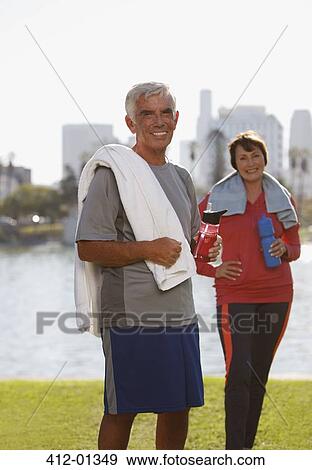 Older couple drinking water after workout View Large Photo Image Stock Photo - Older couple drinking water after workout. Fotosearch