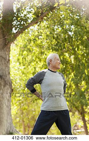 Older man stretching outdoors View Large Photo Image Stock Photograph - Older man stretching outdoors. Fotosearch