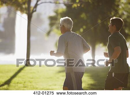 Older men jogging together in park View Large Photo Image Stock Photography - Older men jogging together in park. Fotosearch
