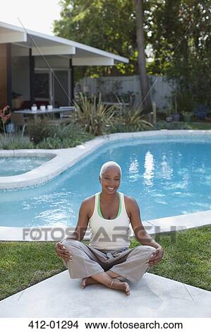 Older woman meditating in backyard View Large Photo Image Picture - Older woman meditating in backyard. Fotosearch