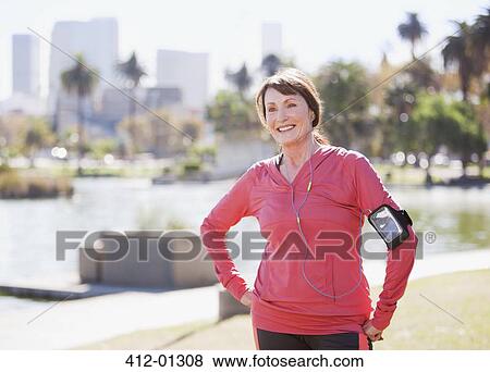 Stock Photo - Older woman walking outdoors. Fotosearch