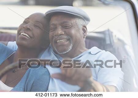 Couple driving in convertible together View Large Photo Image Stock Image - Couple driving in convertible together. Fotosearch
