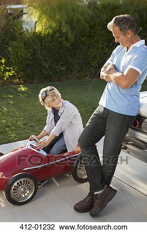 Father and son playing with go cart View Large Photo Image Stock Image - Father and son playing with go cart. Fotosearch