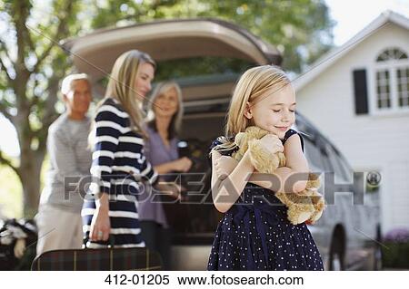 Girl hugging teddy bear outdoors View Large Photo Image Stock Photography - Girl hugging teddy bear outdoors. Fotosearch