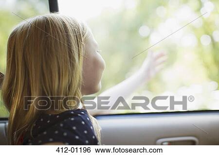 Girl reaching out of car window View Large Photo Image Stock Photograph - Girl reaching out of car window. Fotosearch