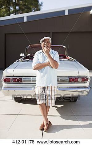 Smiling older man with convertible View Large Photo Image Stock Photograph - Smiling older man with convertible. Fotosearch
