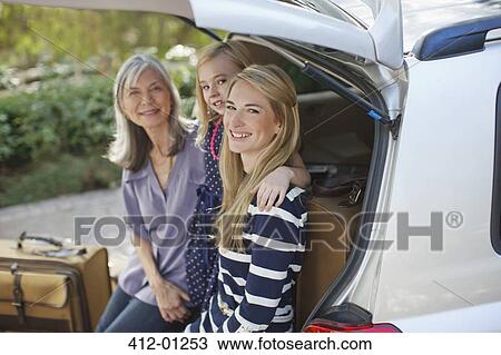 Three generations of women sitting in car View Large Photo Image Stock Image - Three generations of women sitting in car. Fotosearch