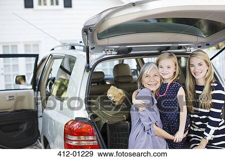 Three generations of women sitting in trunk View Large Photo Image Stock Photo - Three generations of women sitting in trunk. Fotosearch