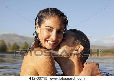 Close up portrait of couple kissing in lake View Large Photo Image Stock Photography - Close up portrait of couple kissing in lake. Fotosearch