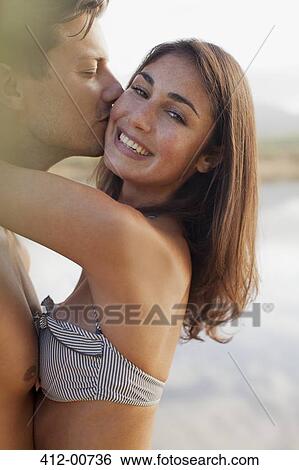 Close up portrait of couple kissing View Large Photo Image Stock Photograph - Close up portrait of couple kissing. Fotosearch