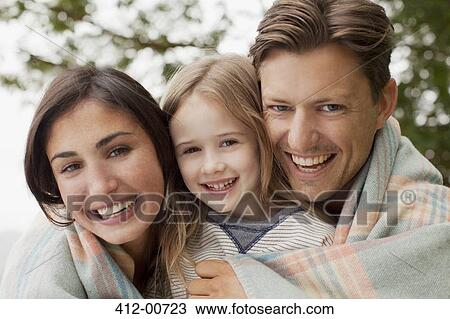 Close up portrait of smiling family wrapped in blanket View Large Photo Image Stock Image - Close up portrait of smiling family wrapped in blanket. Fotosearch